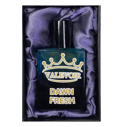 Perfume bottle labeled 'Valevoir Dawn Fresh' on purple fabric